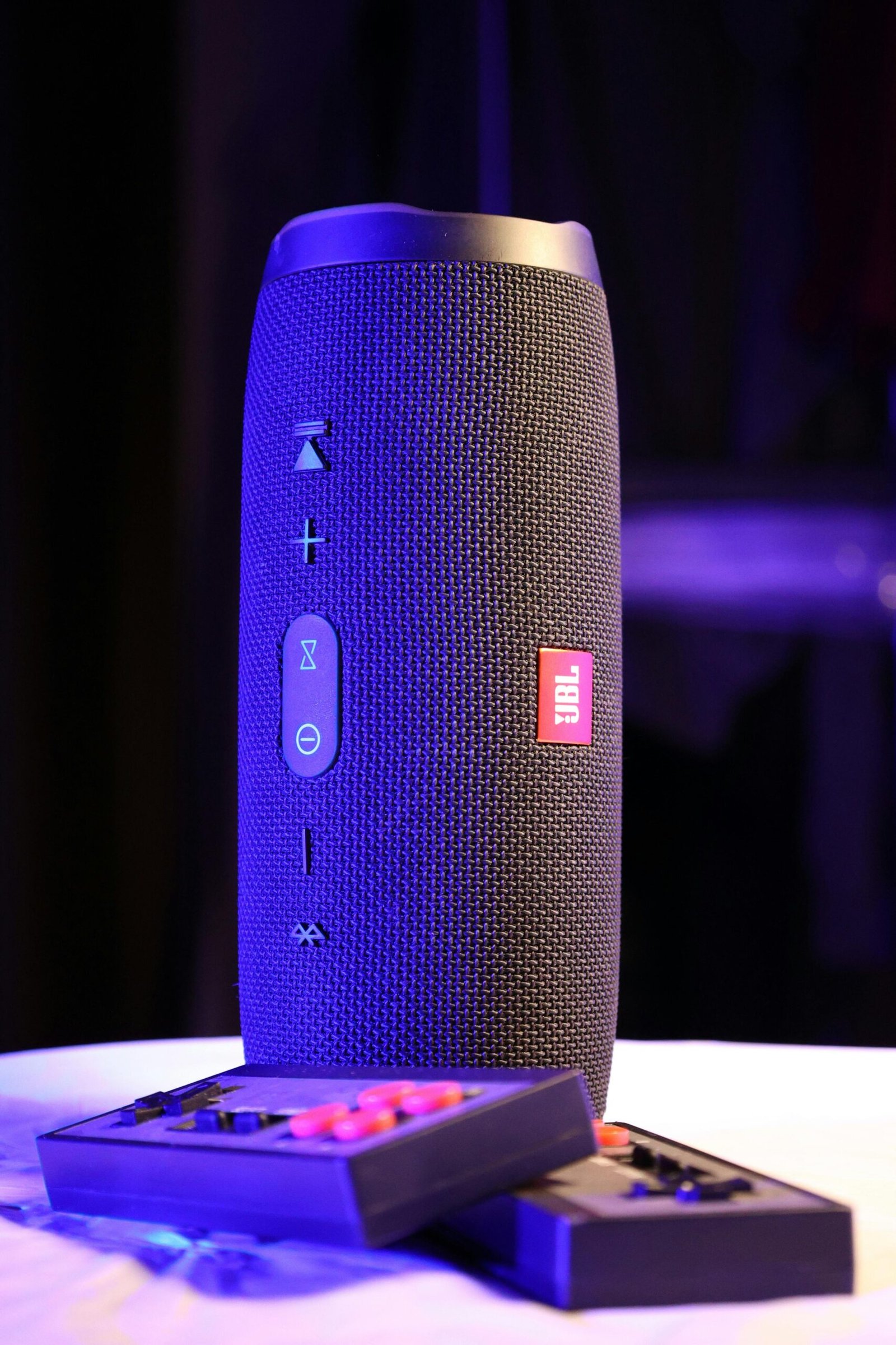 pexels photo 9767549 9767549 Close-up of a JBL portable speaker with its controls, perfect for wireless music streaming.